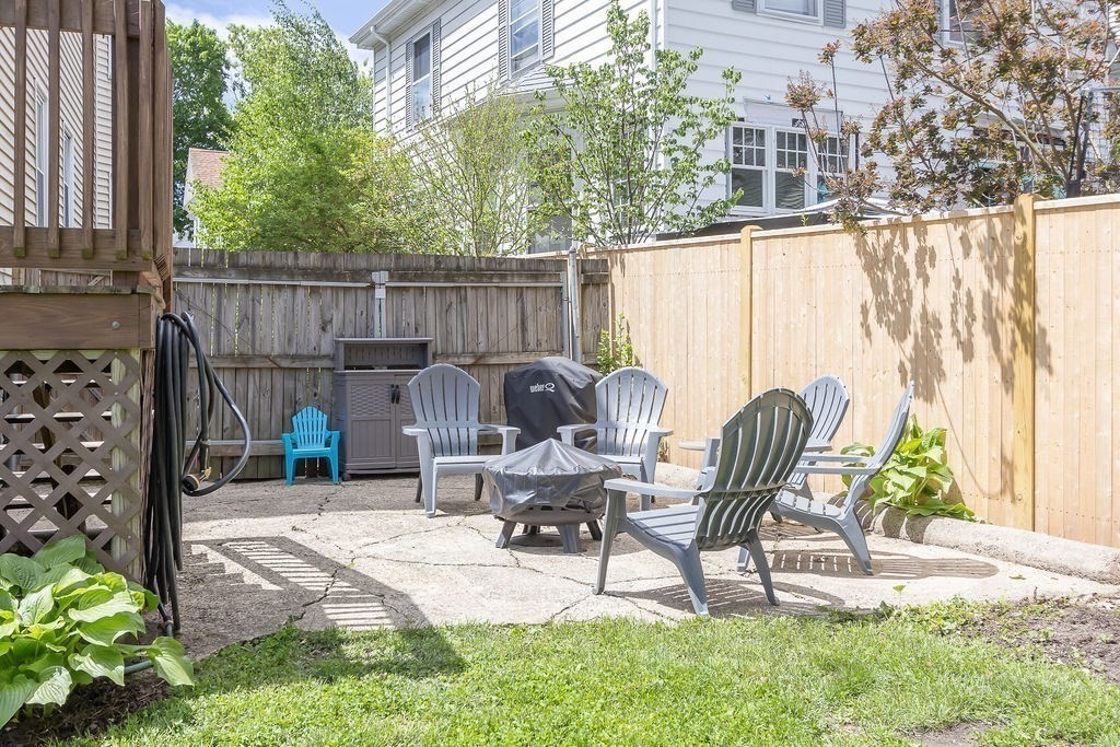 43 Sheffield Road, Unit 2 Boston, MA 02131 - Photo 12 of 16 a view of a chairs and table in the patio