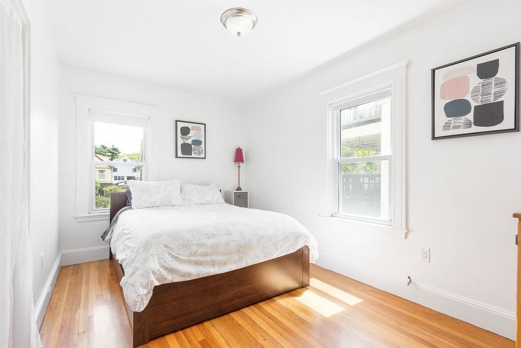 43 Sheffield Road, Unit 2 Boston, MA 02131 - Photo 8 of 16 a bedroom with a bed and a window