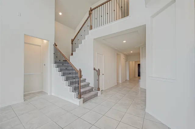 a view of entryway and hall with a front door