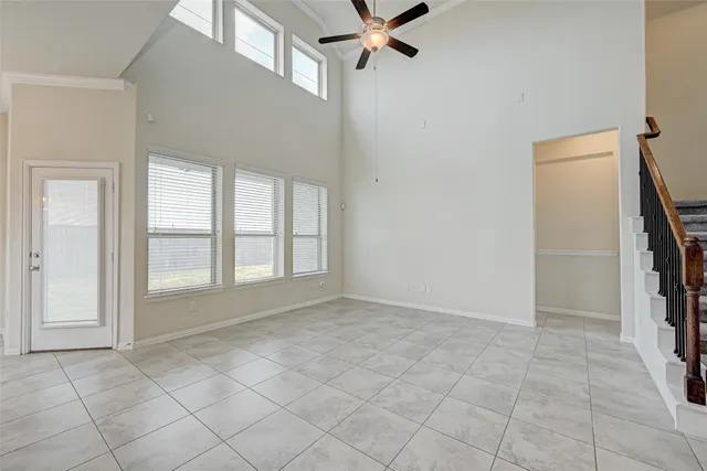 an empty room with windows and closet