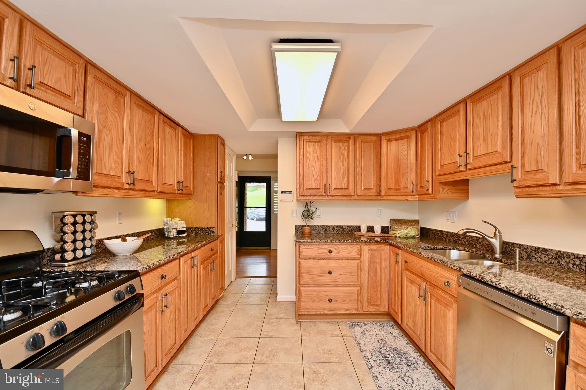 1012 Moorefield Creek Road Southwest Vienna, VA 22180 - Photo 5 of 35 Huge kitchen includes a desk area, ceiling fan