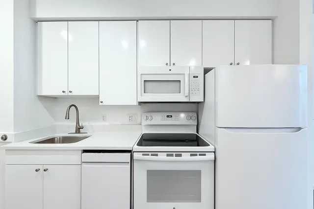 a view of a kitchen with wooden floor