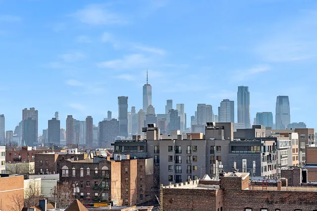 a view of a city with tall buildings