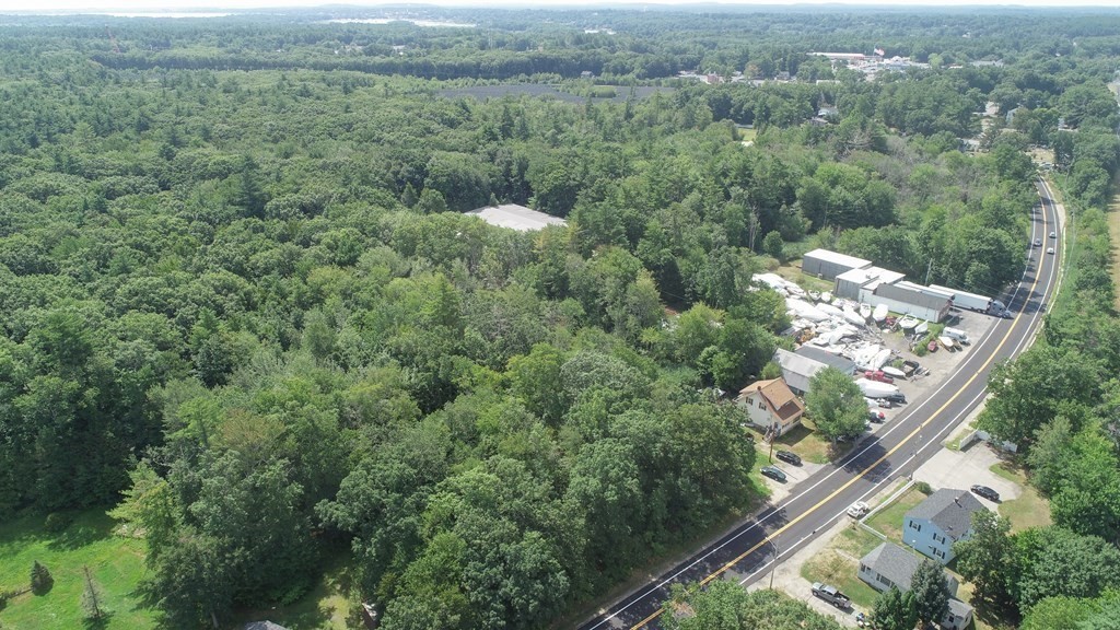 49 Rabbit Road Salisbury, MA 01952 - Photo 27 of 29 an aerial view of a residential houses with outdoor space and trees