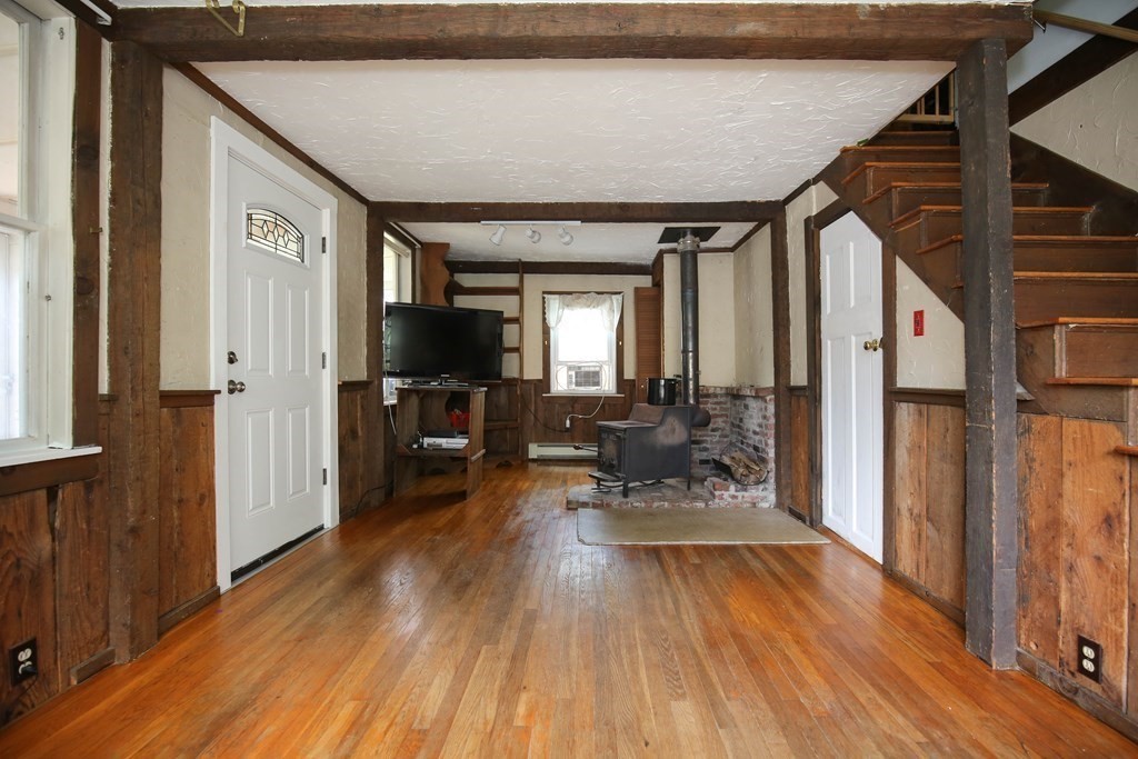 49 Rabbit Road Salisbury, MA 01952 - Photo 8 of 29 a view of a hallway with wooden floor and furniture
