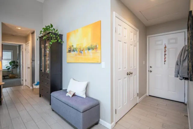 a bedroom with a bed and a potted plant