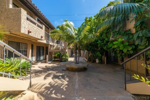 a backyard of a house with outdoor seating