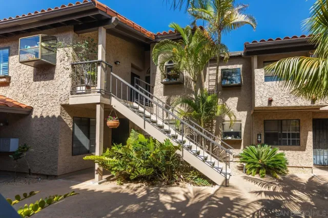 a view of a house with a flower garden