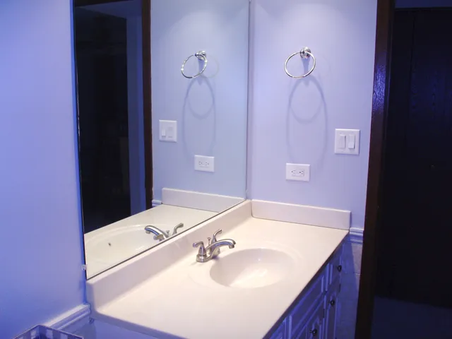 a bathroom with a sink and a mirror