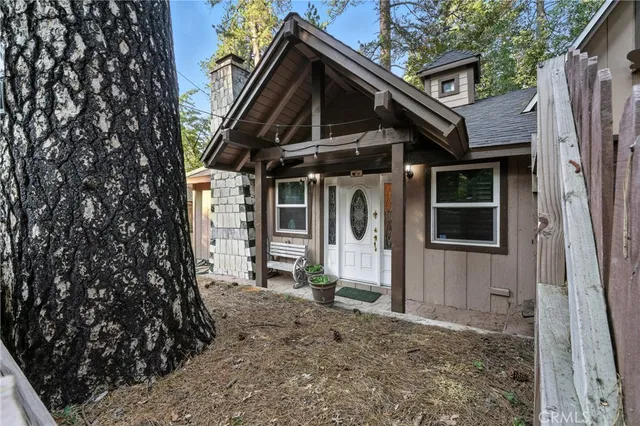 a living room with furniture a rug and a wall painting