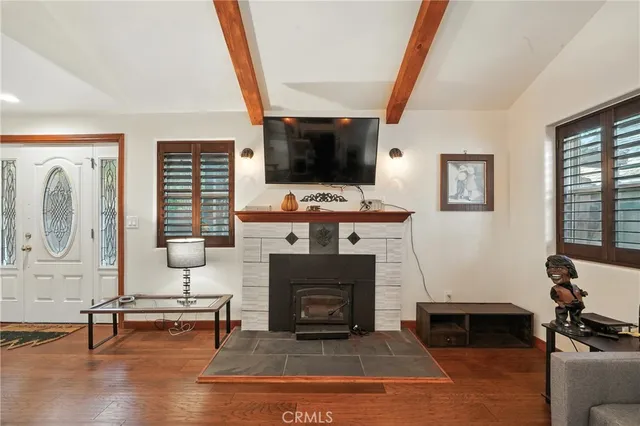 a bedroom with a bed and a night stand