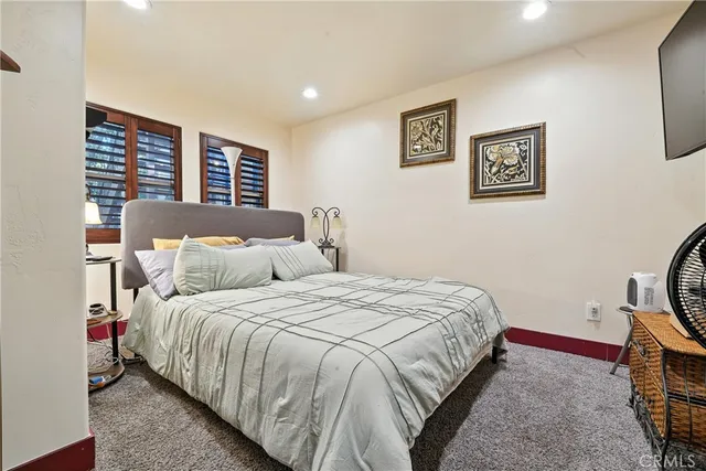 a kitchen with granite countertop a stove a sink and a refrigerator