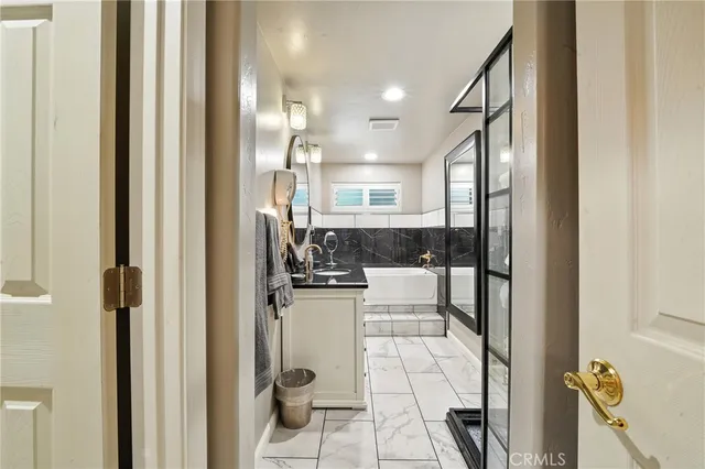 a kitchen with a sink cabinets and window
