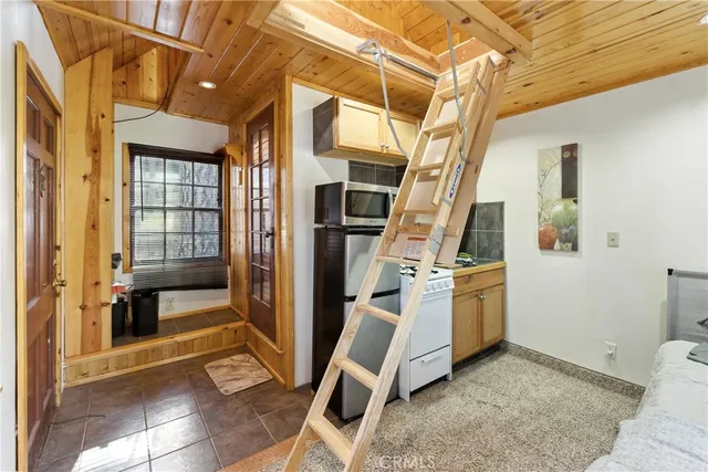 a view of a lush green field with a mountain in the background
