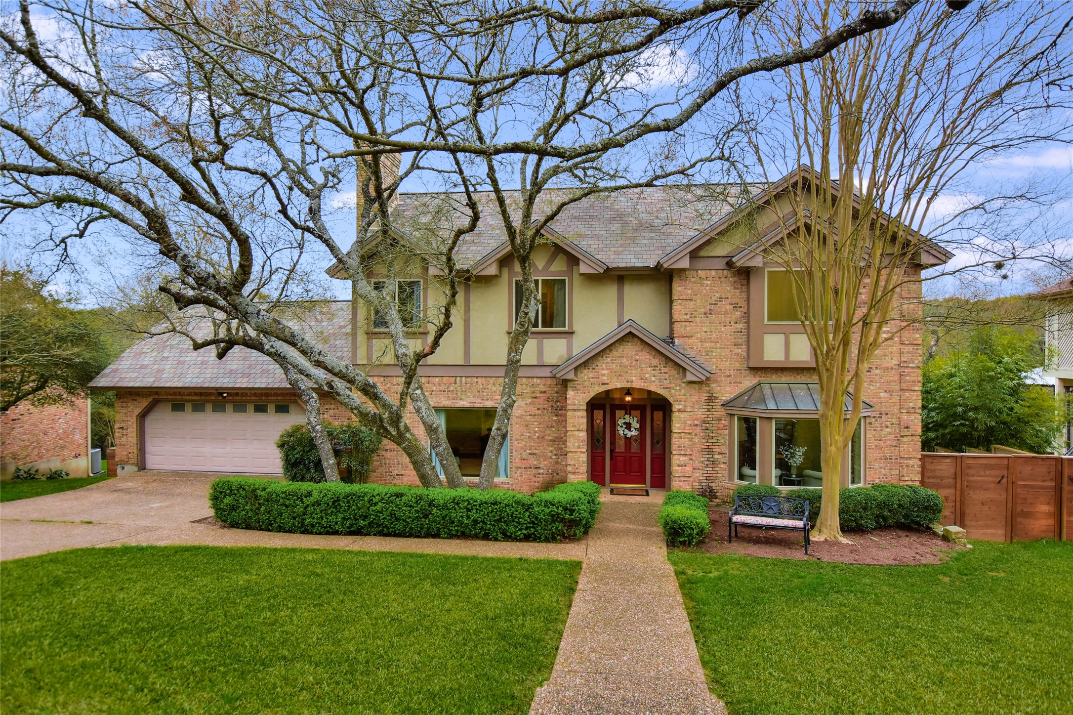 2004 Key West Cove Austin, TX 78746 - Photo 1 of 1 a front view of a house with garden