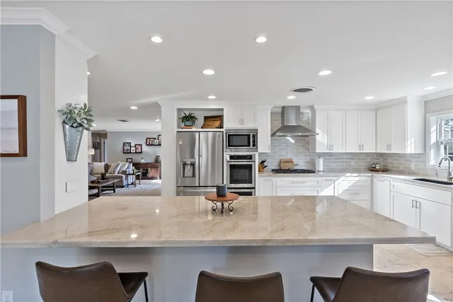 a kitchen with counter top space cabinets and appliances