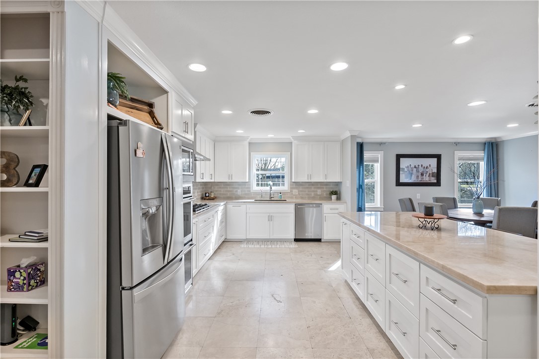 507 Crescent Drive Bryan, TX 77801 - Photo 13 of 41 a large kitchen with stainless steel appliances lots of counter top space