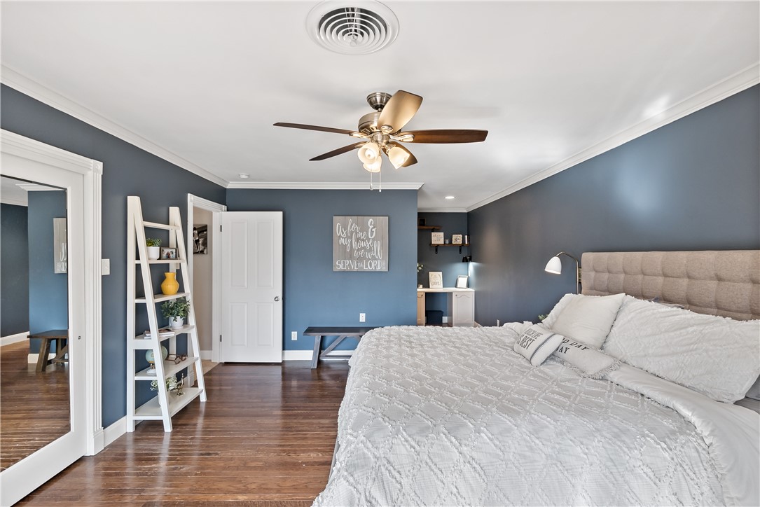 507 Crescent Drive Bryan, TX 77801 - Photo 28 of 41 a bedroom with a bed and a chandelier