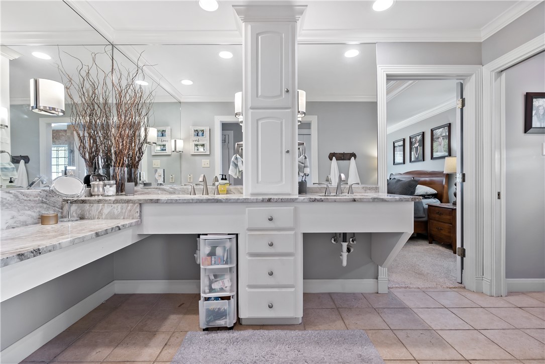 507 Crescent Drive Bryan, TX 77801 - Photo 34 of 41 a bathroom with a sink double vanity and a mirror
