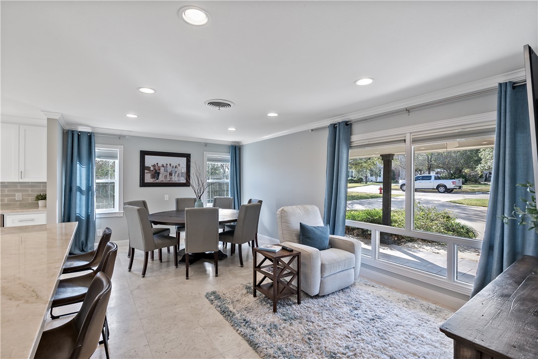 507 Crescent Drive Bryan, TX 77801 - Photo 6 of 41 a living room with furniture and a floor to ceiling window