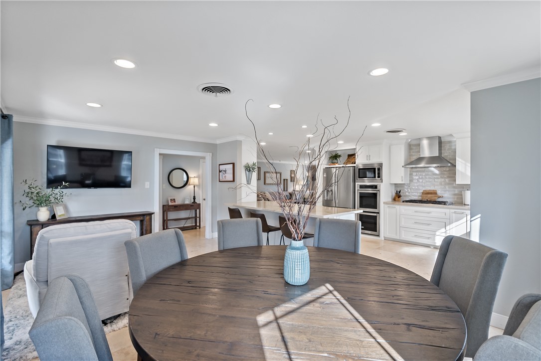 507 Crescent Drive Bryan, TX 77801 - Photo 8 of 41 a dining room with furniture and a flat screen tv