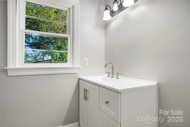 a bathroom with a sink and a vanity
