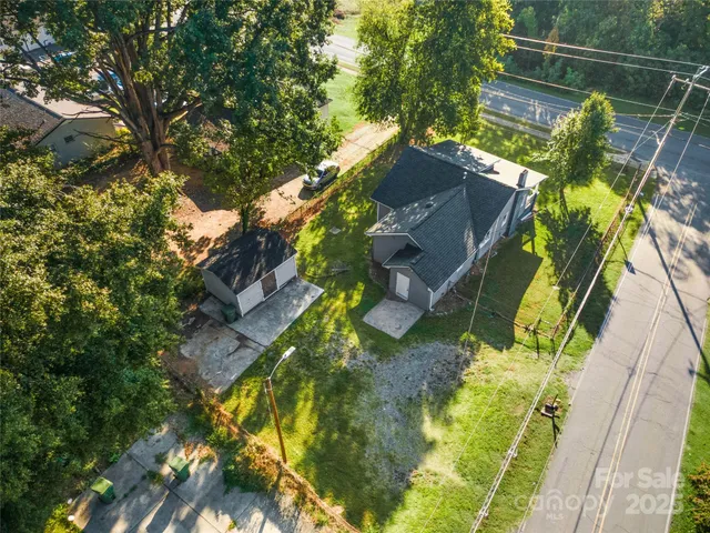 an aerial view of residential houses and outdoor space
