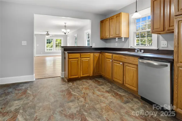 a view of a kitchen with granite countertop cabinets and a sink