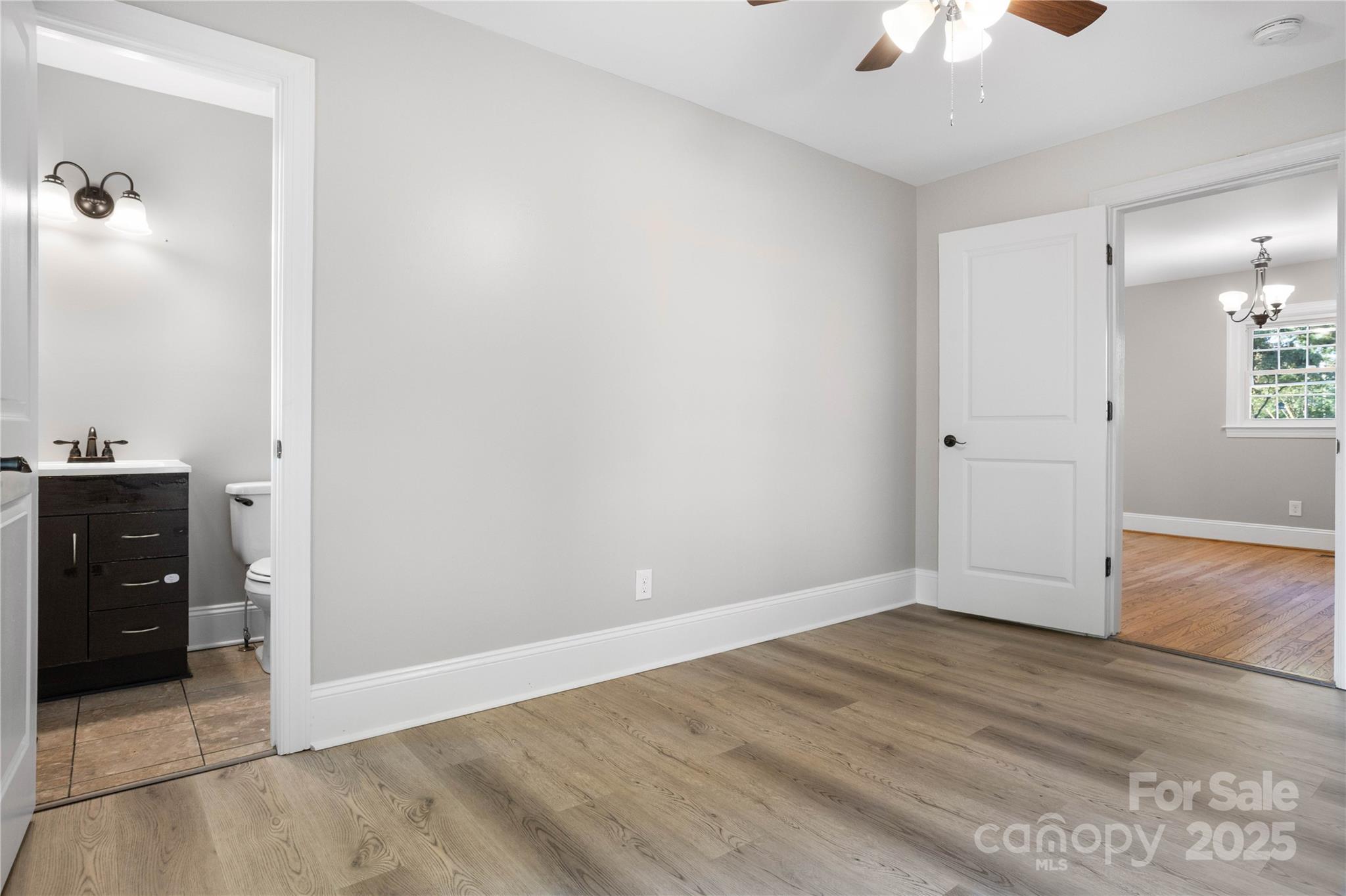 1306 South Main Street Mount Holly, NC 28120 - Photo 8 of 18 wooden floor in an empty room