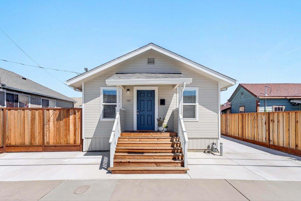 152 Grove Street Watsonville, CA 95076 - Photo 1 of 35 a front view of a house with a porch