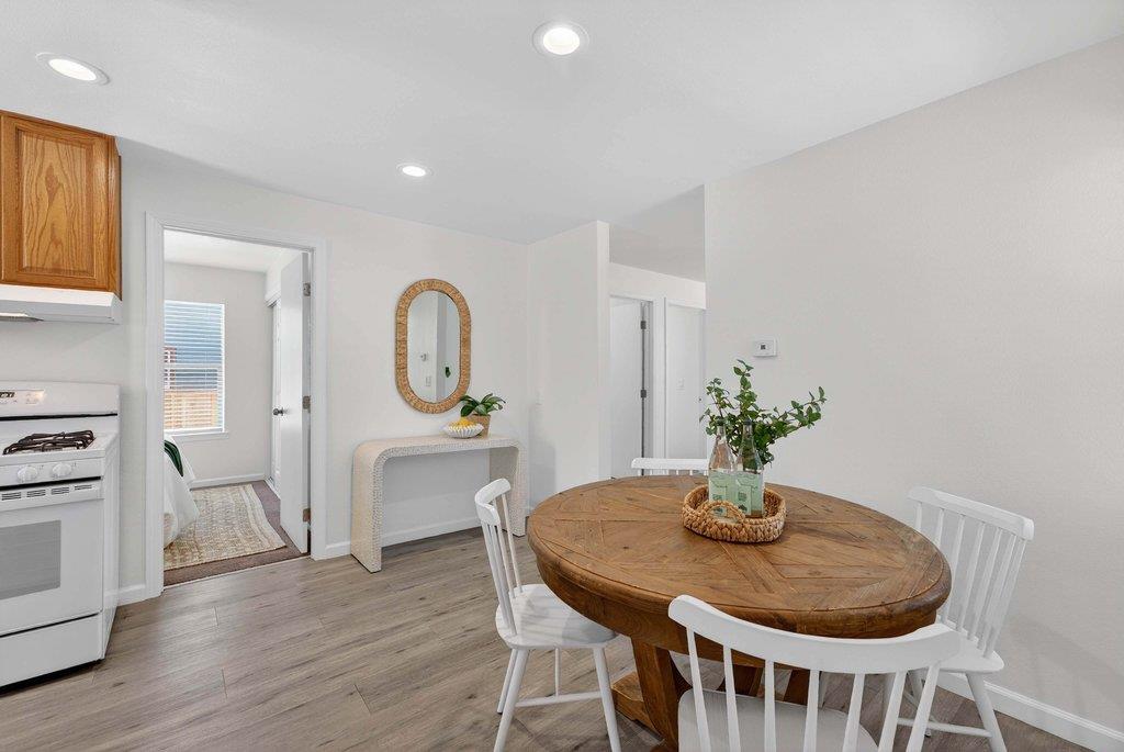 152 Grove Street Watsonville, CA 95076 - Photo 11 of 35 a view of a dining room with furniture window and wooden floor
