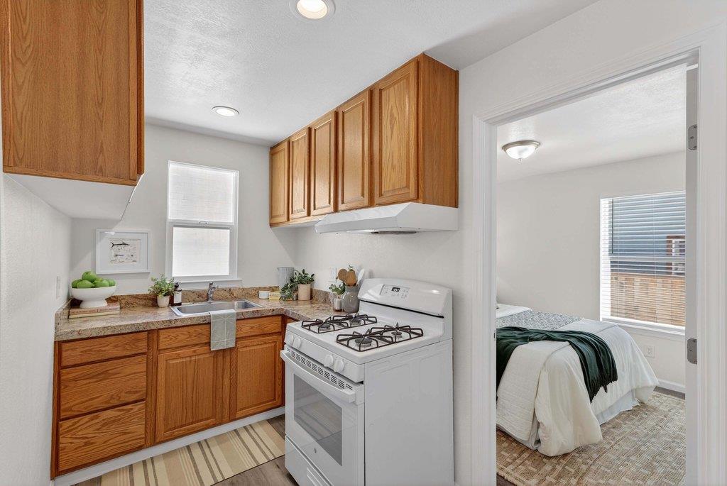 152 Grove Street Watsonville, CA 95076 - Photo 14 of 35 a kitchen with a sink cabinets and window
