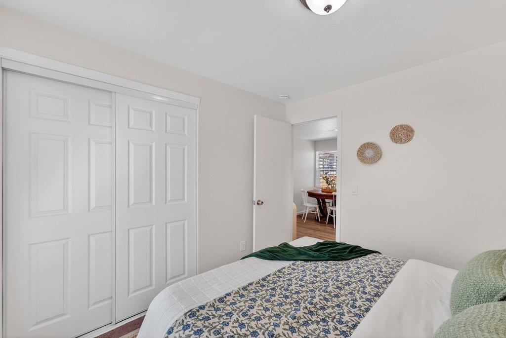 152 Grove Street Watsonville, CA 95076 - Photo 20 of 35 a bedroom with a bed and a table