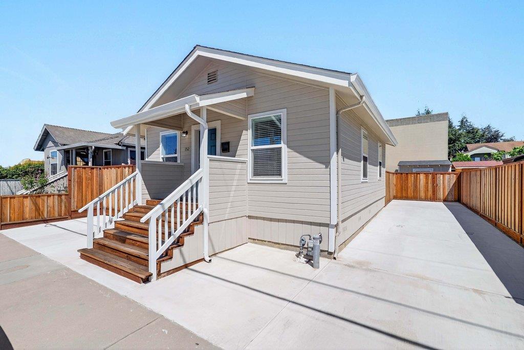152 Grove Street Watsonville, CA 95076 - Photo 2 of 35 a view of a house with a wooden deck