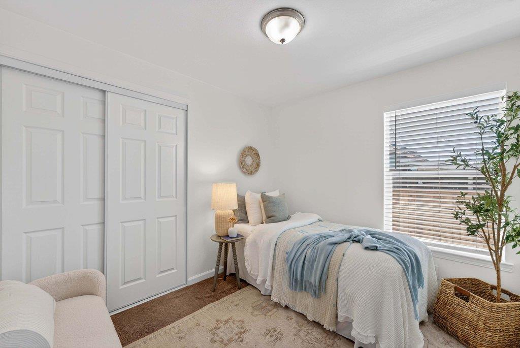 152 Grove Street Watsonville, CA 95076 - Photo 23 of 35 a bedroom with a bed and a couch