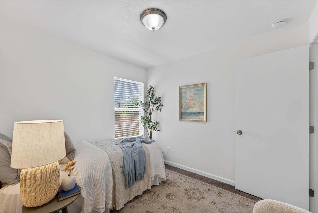 152 Grove Street Watsonville, CA 95076 - Photo 24 of 35 a bedroom with a bed and window