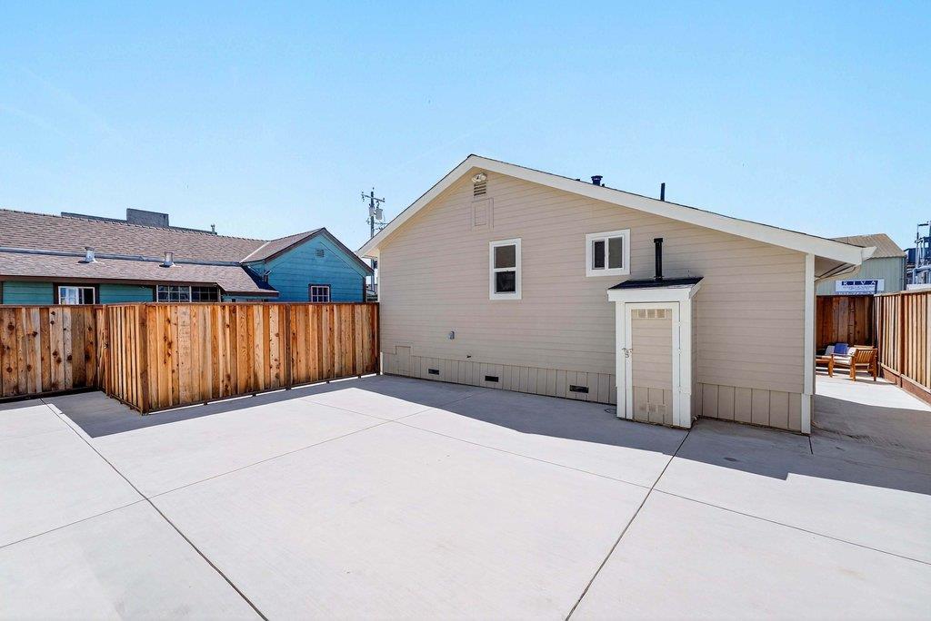 152 Grove Street Watsonville, CA 95076 - Photo 27 of 35 a view of a house with wooden fence