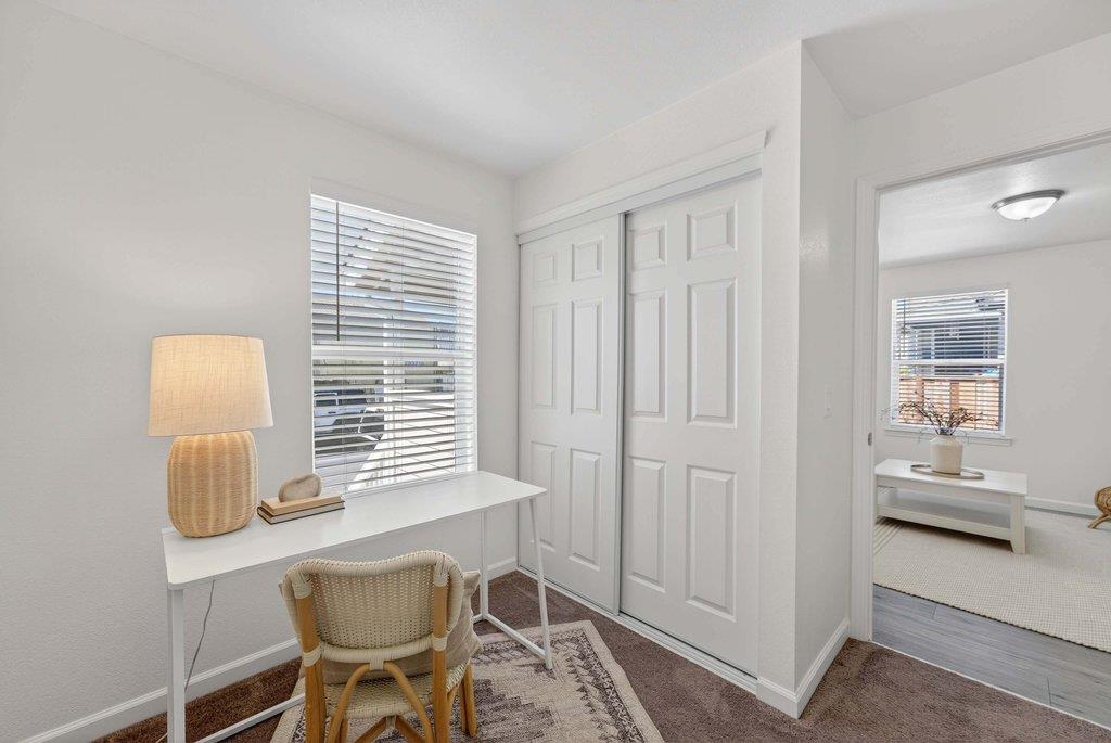 152 Grove Street Watsonville, CA 95076 - Photo 9 of 35 a room with a chair and a window