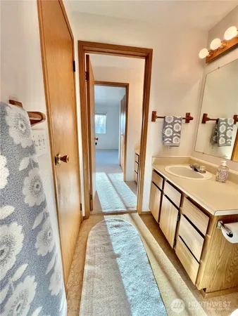 a bathroom with a sink a mirror and shower