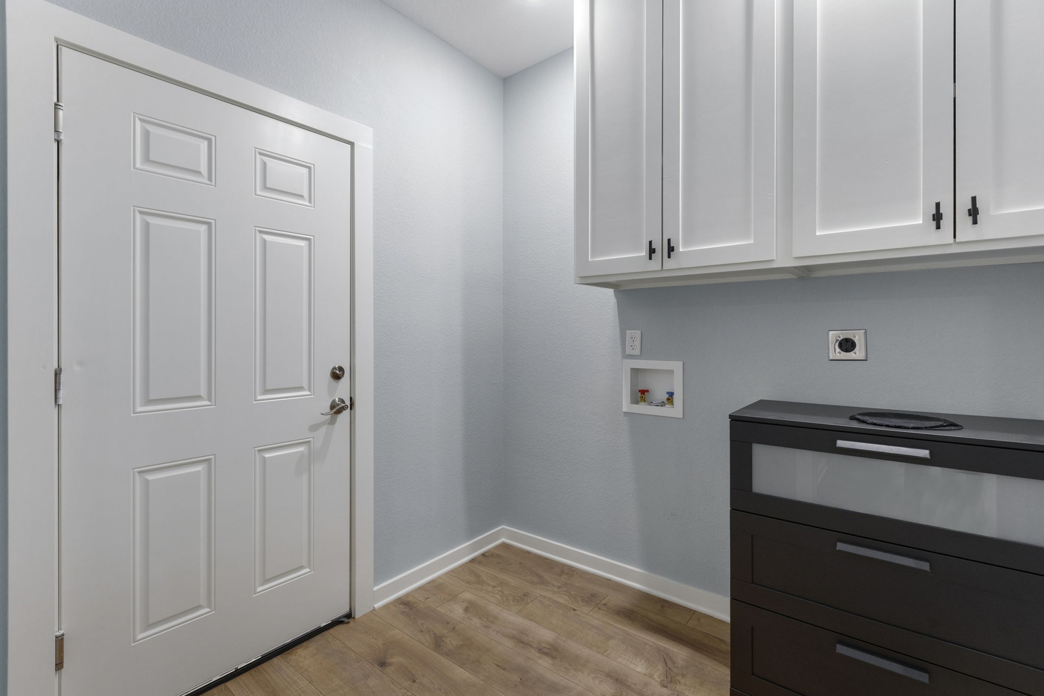 700 South Church Street Lockhart, TX 78644 - Photo 28 of 37 Laundry room with extra storage.