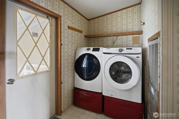 a utility room with dryer and washer