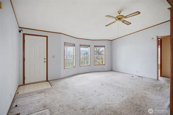 a view of an empty room with a window