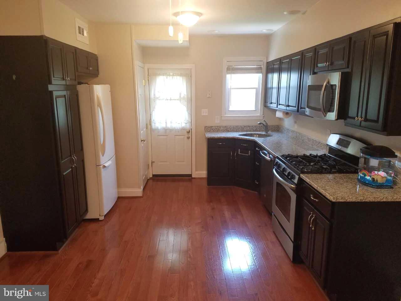 6808 Dunhill Road Baltimore, MD 21222 - Photo 8 of 30 Updated Kitchen with hardwood floors.