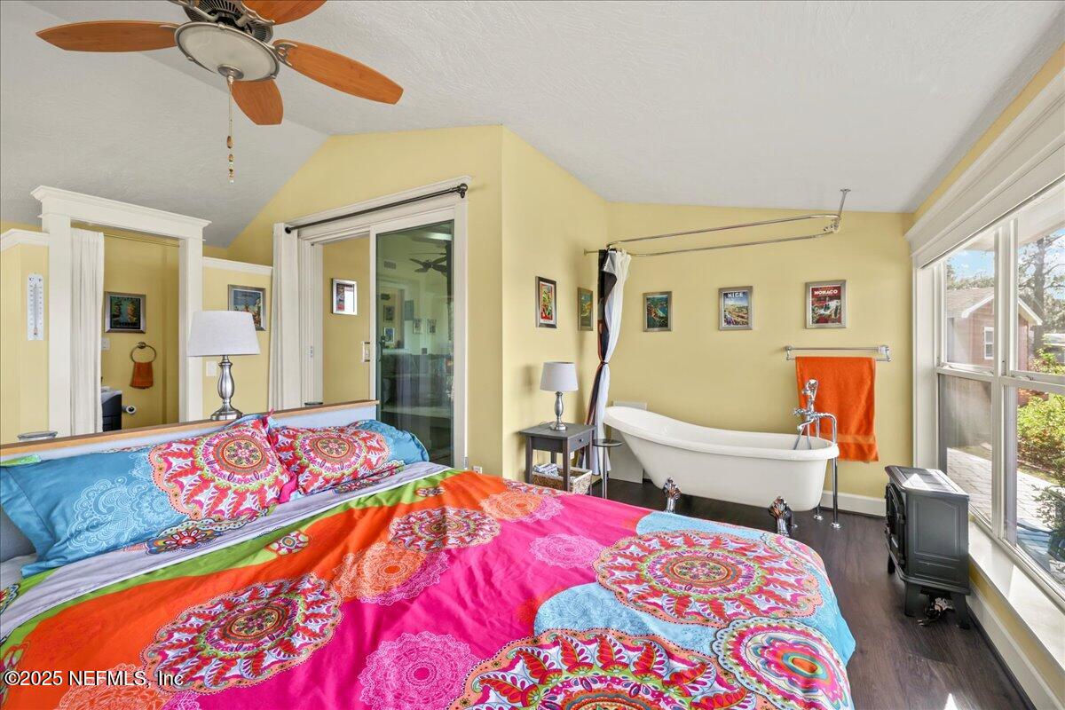 802 Lemon Avenue Crescent City, FL 32112 - Photo 11 of 46 a bedroom with a bed and wooden floor