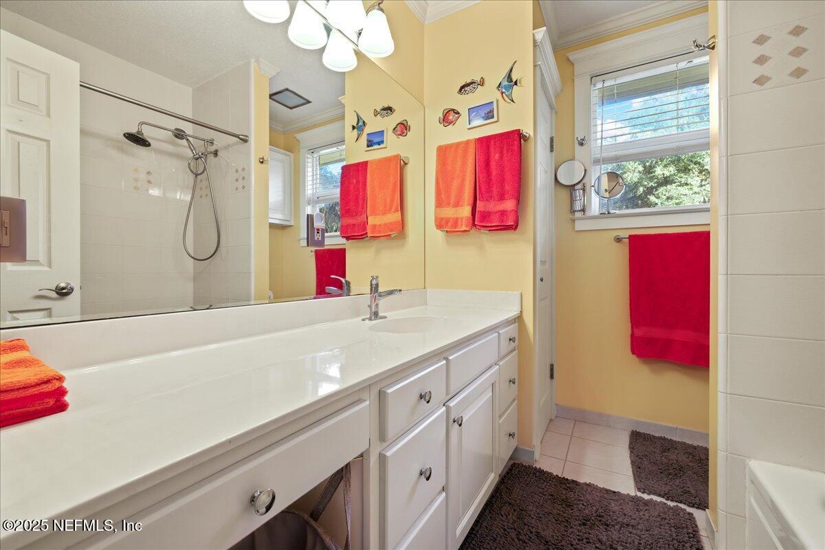 802 Lemon Avenue Crescent City, FL 32112 - Photo 15 of 46 a bathroom with a sink vanity and a mirror