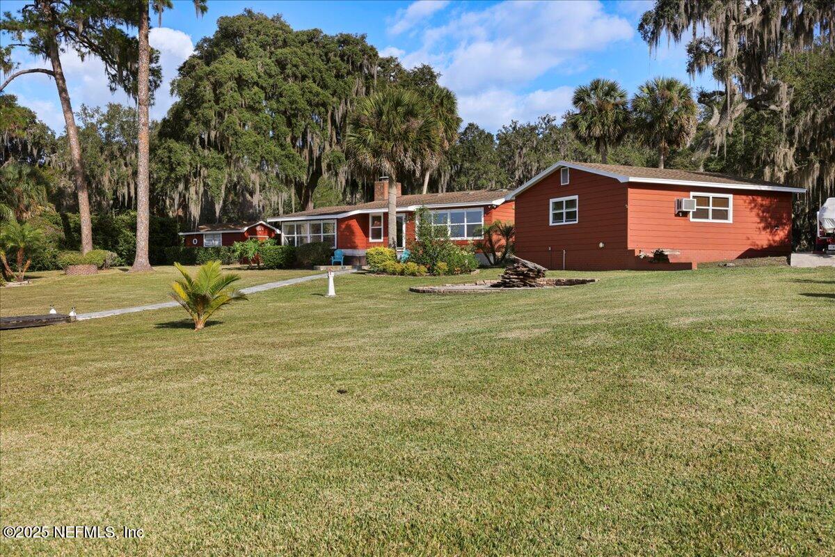 802 Lemon Avenue Crescent City, FL 32112 - Photo 28 of 46 a house with trees in front of it