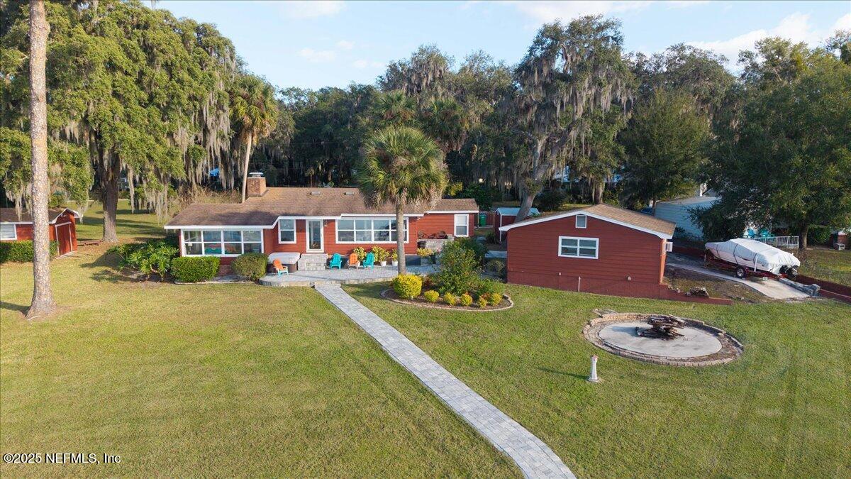 802 Lemon Avenue Crescent City, FL 32112 - Photo 37 of 46 a view of a house with pool table and chairs
