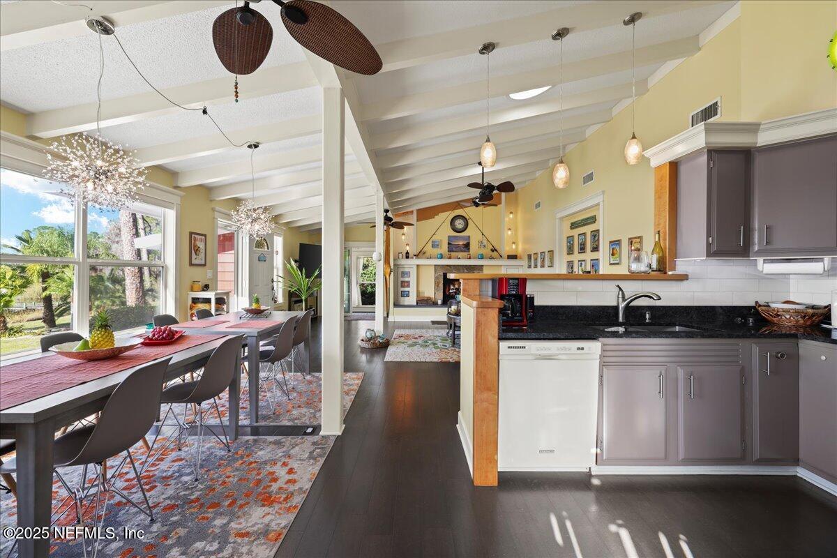 802 Lemon Avenue Crescent City, FL 32112 - Photo 8 of 46 a kitchen with a stove a refrigerator and a dining table