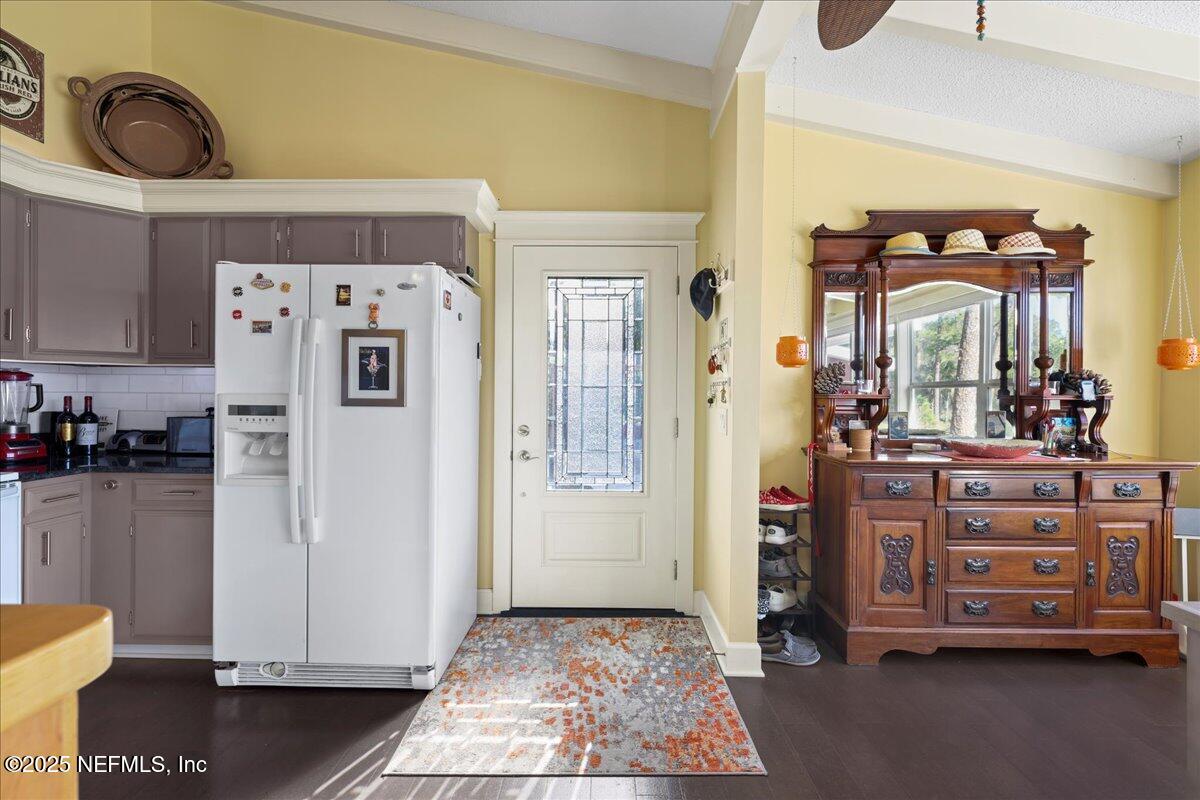 802 Lemon Avenue Crescent City, FL 32112 - Photo 9 of 46 a view of kitchen with refrigerator and cabinets
