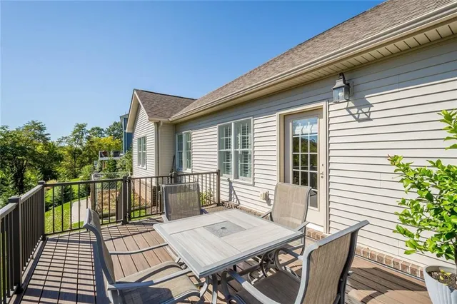 a view of a patio with a table and chairs
